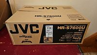 Closed JVC cardboard box showing HR-S7600U model branding and SVHS logo