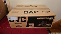 Sealed outer box showing JVC branding and model HR-S7600U