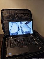 Open Lenovo ThinkPad T430s placed in laptop bag