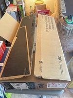 Closed retail box with LG UltraWide Monitor branding and size information