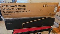 Front of sealed LG UltraWide Monitor box showing 34-inch size, model 34WK500 and IPS, 2560x1080 details