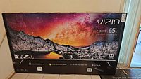 Front of factory sealed box showing Vizio logo, P-Series branding, 65" size, and 4K HDR Smart TV labels
