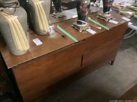 Front view of dresser with lamps on top showing overall finish and style