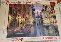 Box for Clementoni 1000-piece puzzle titled Romantic Italy showing an Italian canal scene