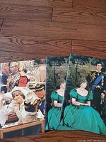 Three Royal Wedding photo books depicting Prince Charles and Princess Diana in formal attire on front covers.