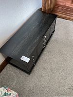 Top-front view of the Lane cedar chest showing dark finished wood exterior and metal hardware on front.