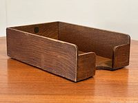 Side and perspective view of an antique oak desk tray showing wood grain and condition including wear and structural integrity