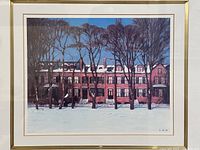 Close-up of the framed art print showing the artwork and gold frame edge.