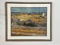 Framed art print of Van Gogh's The Harvest showing entire framed image with matting and silver frame.