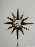 Full front view of the clock hanging on a wall