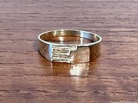 Front view showing textured rectangular detail on band