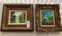 Wide view of two framed paintings side by side