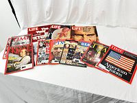 Lot of 12 vintage Time and Life special issue magazines arranged on a white backdrop. Covers show varied iconic subjects and themes.
