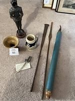 View of all items including miniature armor, two fishing spears, ceramic bowl, beer stein, and mini cutlass