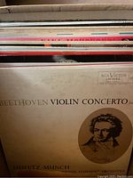 Box with stack of 26 classical vinyl records showing Beethoven Violin Concerto album cover with artist and orchestra details on visible sleeve.
