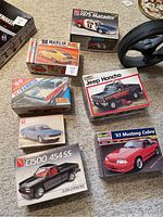 Overhead view of all seven model kit boxes