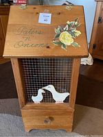 Front side showing text 'Paters n' Onions' with floral painted decoration on hinged lid and wire mesh front with painted ducks.