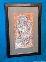 Framed abstract portrait artwork showing full piece with black frame and gray matting.