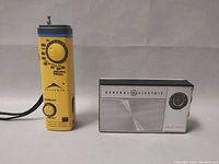 Front view of General Electric radio and Alliance handheld radio side by side showing the front face and controls