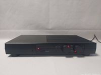 Front view of Rega Cursa pre-amplifier showing power LED, input selector and tape monitor switch, volume and selector knobs