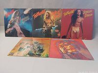 Five vinyl record album covers displayed, front side showing three Ted Nugent albums and two Ten Years After albums.