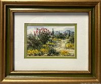 Framed watercolour painting of desert landscape with flowering cacti, showing overall item