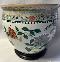 Front view showing geometric hexagonal border and floral motifs