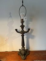 Full view of lamp unlit showing overall structure, candle arms, harp, and base