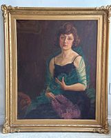 Full view of oil painting in carved gilt wood frame