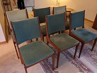 All six chairs arranged on floor showing overall set and matching upholstery.
