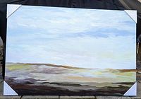 Front view of the large contemporary serene landscape painting on canvas with corner protectors, set outdoors against a black backdrop.