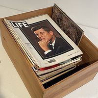 Box filled with a stack of vintage Life magazines, front cover John F. Kennedy dated November 1961