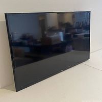 Front view of Samsung 40 inch LED TV powered off, showing the screen and slim bezel.