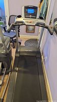 Full view of Life Fitness treadmill showing the running belt, handrails, and console.