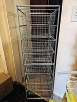 Full view of the wire basket drawer unit showing all 7 baskets and metal frame.