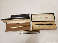 4 Cross vintage pens, 1 gold filled soft tip pen in box, 1 black classic pen in box, 2 additional pens in gold and silver tone