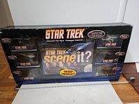 Front view of the sealed Star Trek Scene It Ultimate Fan Pack box showing the DVD game and spaces for six diecast ships.