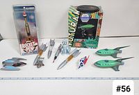Full view of all rocket and spaceship toys including Rocket Pen, two Planet Express Ships, and small rockets with robot