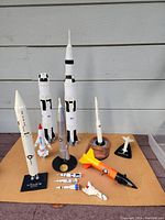 Overview of 12 NASA rocket and space shuttle models, including Saturn V, Titan II, Minuteman, Mercury-Redstone, X-15 and shuttle.