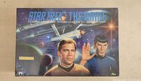 Front view of sealed game box showing Captain Kirk and Spock artwork.