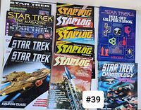 Front covers of Star Trek magazines and Starlog magazines along with two Star Trek books.