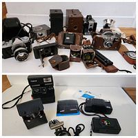 Second overview including cameras and leather cases, a vintage flash unit and tripod.