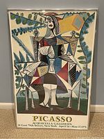Front view of framed Picasso poster showing full artwork and text.