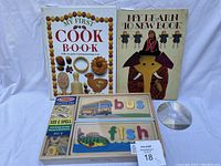 Set showing both books and the Melissa & Doug See and Spell puzzle with a CD for size reference on white background.