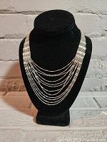 Full view of the vintage ladies retro silver-tone multi-strand necklace showing overall style and structure.