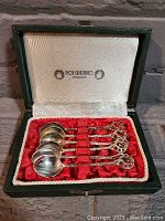 Boxed set of six vintage Polsrebro Poznan silver sugar spoons in original green case with red velvet and white satin interior lining.