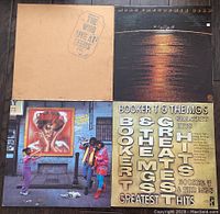 Four vinyl records showing front album cover artwork including The Who, Booker T & The MG's, Aretha Franklin.