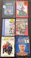Photo of six DVDs showing Monty Python and the Holy Grail collector's edition, Royal Tenenbaums, Movie Marathon 3-disc set, Monty Python's The Meaning of Life, The Animal, and Ace Ventura: Pet Detective.