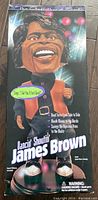 Front of box of James Brown figure showing caricature image and features.