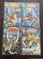 Four Doc Savage comic books with illustrated action covers including armed men and figures in combat.